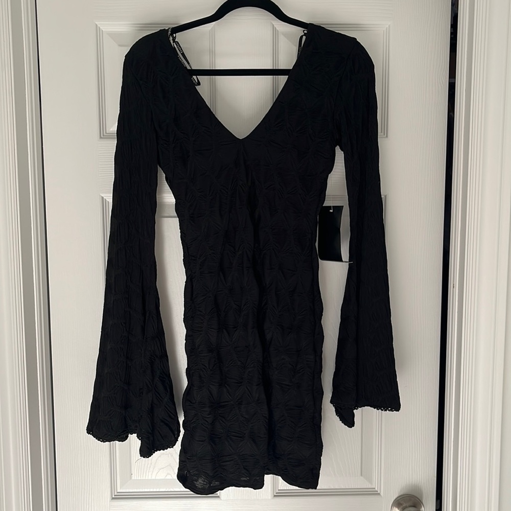 BEBE Fitted black dress with bell sleeves